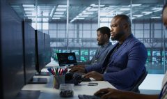 portrait-happy-server-room-worker-developing-disaster-recovery-plans