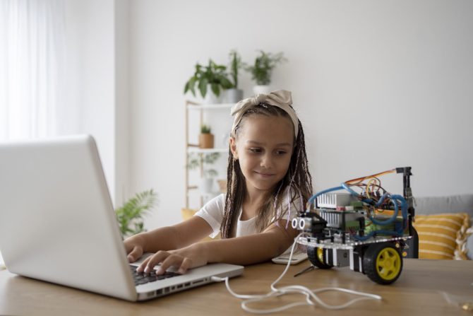 adorable-girl-being-passionate-about-robotics