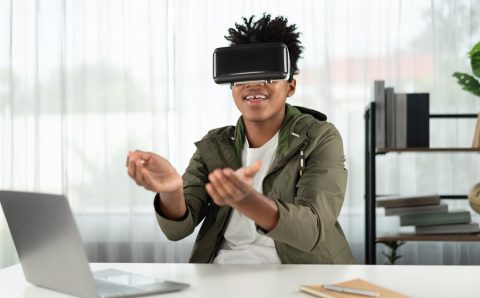 african-american-looking-through-vr-holding-interesting-data-meta-contrivance_31965-566576